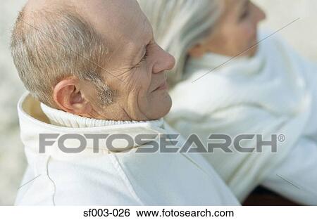 Stock Photograph - Senior in white couple looking away. Fotosearch