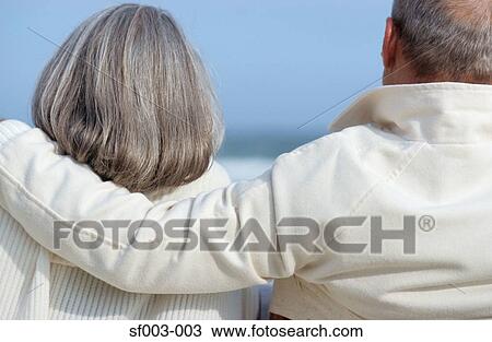 Senior man with arm around senior woman View Large Photo Image Stock Image - Senior man with arm around senior woman. Fotosearch