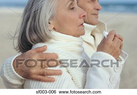 Senior woman sneezing and walking with senior man View Large Photo Image Stock Photograph - Senior woman sneezing and walking with senior man. Fotosearch