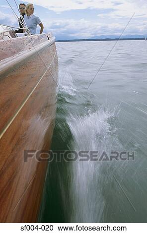 Boat in motion with couple on board View Large Photo Image Stock Image - Boat in motion with couple on board. Fotosearch