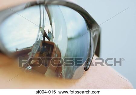 Close-up of sunglasses with reflection of boat View Large Photo Image Stock Photography - Close-up of sunglasses with reflection of boat. Fotosearch