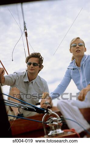 Couple sailing boat View Large Photo Image Stock Photo - Couple sailing boat. Fotosearch