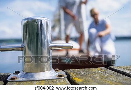 People on boat approaching jetty View Large Photo Image Stock Image - People on boat approaching jetty. Fotosearch