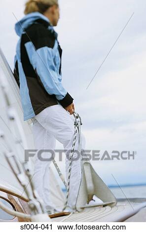Woman on boat holding anchor View Large Photo Image Stock Image - Woman on boat holding anchor. Fotosearch