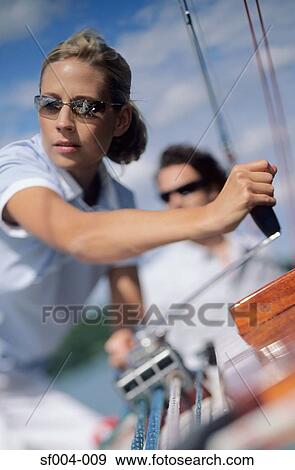 Woman turning crank handle View Large Photo Image Stock Photo - Woman turning crank handle. Fotosearch