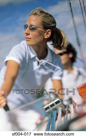 Stock Photo - Woman turning crank handle. Fotosearch