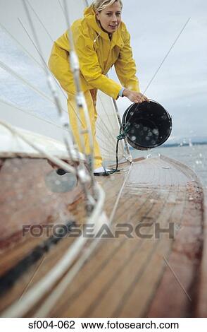 Woman washing deck of boat View Large Photo Image Stock Image - Woman washing deck of boat . Fotosearch