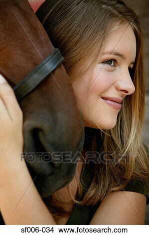 Picture - Young woman and her horse. Fotosearch
