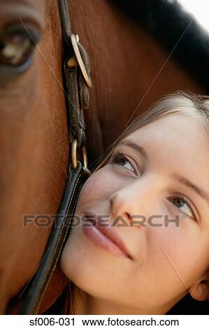Young woman and her horse View Large Photo Image Stock Image - Young woman and her horse. Fotosearch