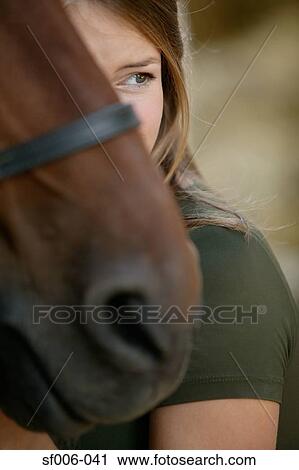 Young woman and her horse View Large Photo Image Stock Image - Young woman and her horse. Fotosearch