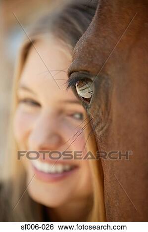 Young woman and her horse View Large Photo Image Stock Photograph - Young woman and her horse. Fotosearch