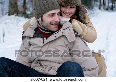 Couple on a sled View Large Photo Image Stock Image - Couple on a sled. Fotosearch