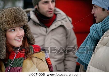 Friends in winter clothes View Large Photo Image Stock Photograph - Friends in winter clothes. Fotosearch