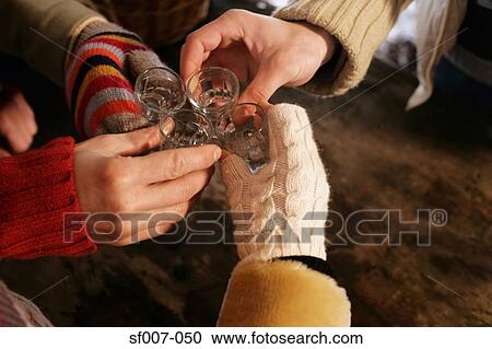 Friends raising a toast View Large Photo Image Stock Image - Friends raising a toast. Fotosearch