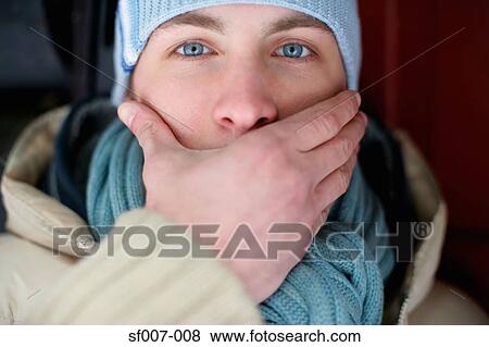 Man covering his mouth View Large Photo Image Stock Photo - Man covering his mouth. Fotosearch