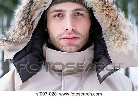 Stock Photo - Man in a coat with furry hood. Fotosearch