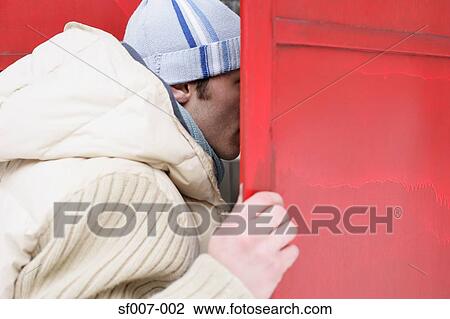 Stock Image - Man opening shutters. Fotosearch