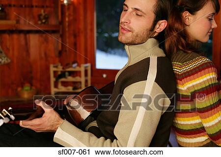 Man playing guitar for girlfriend View Large Photo Image Stock Image - Man playing guitar for girlfriend. Fotosearch