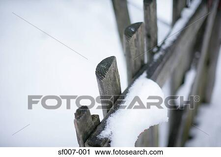 Snow on a fence View Large Photo Image Stock Image - Snow on a fence. Fotosearch