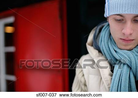 Stock Photo - Sullen man in winter clothes. Fotosearch