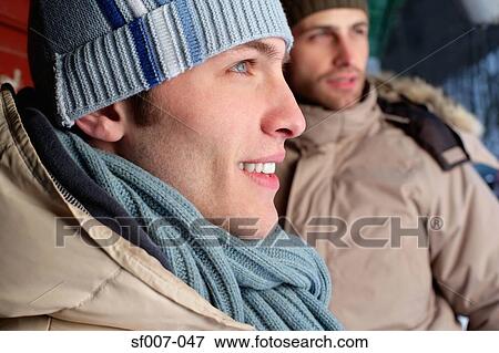 Stock Photo - Two young men in winter clothes. Fotosearch