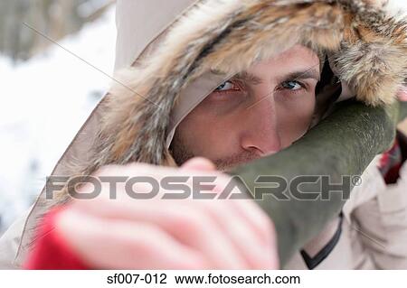 Young man with a fur hood View Large Photo Image Stock Image - Young man with a fur hood. Fotosearch