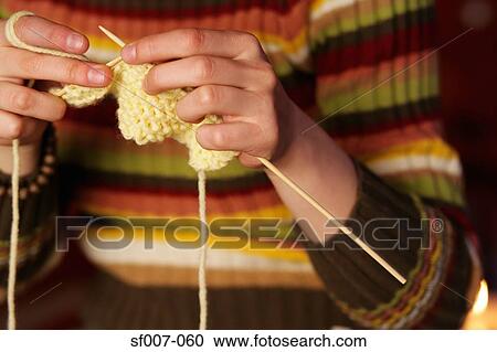 Young woman knitting View Large Photo Image Stock Image - Young woman knitting. Fotosearch