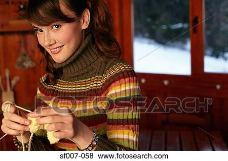 Young woman knitting View Large Photo Image Stock Photo - Young woman knitting. Fotosearch