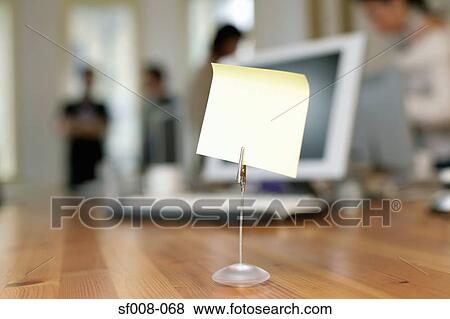 Blank note in holder on desk View Large Photo Image Stock Photo - Blank note in holder on desk. Fotosearch