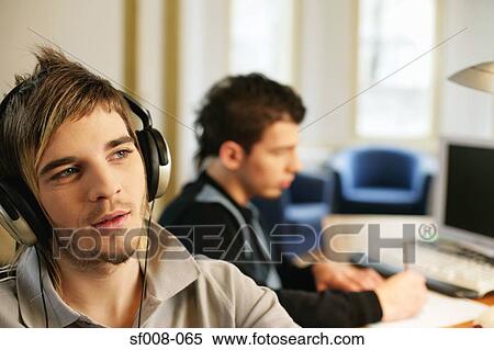 Colleagues in an office View Large Photo Image Stock Photography - Colleagues in an office. Fotosearch
