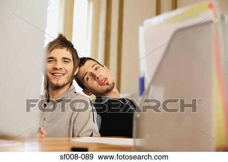Happy male colleagues View Large Photo Image Stock Photo - Happy male colleagues . Fotosearch