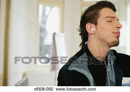 Man enjoying his music View Large Photo Image Stock Image - Man enjoying his music. Fotosearch