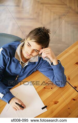 Thinking man with paper and pen View Large Photo Image Stock Photography - Thinking man with paper and pen . Fotosearch
