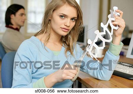 Woman making a paper chain View Large Photo Image Stock Photograph - Woman making a paper chain. Fotosearch