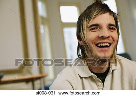 Stock Image - Young man laughing. Fotosearch