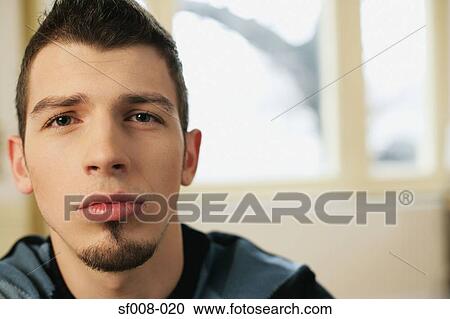 Young man with goatee View Large Photo Image Stock Image - Young man with goatee. Fotosearch