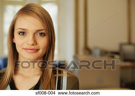 Picture - Young woman in an office. Fotosearch