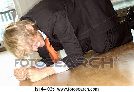Businessman kneeling on floor View Large Photo Image Stock Photography - Businessman kneeling on floor. Fotosearch