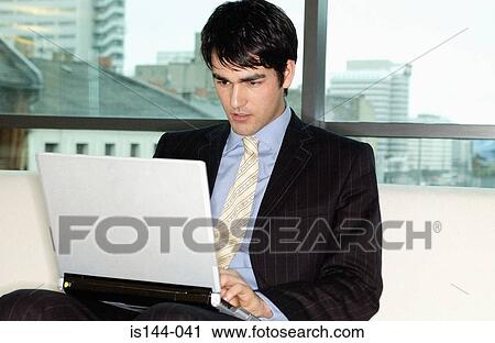 Businessman using laptop computer View Large Photo Image Stock Image - Businessman using laptop computer. Fotosearch
