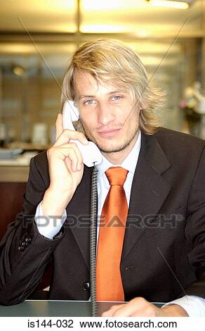 Stock Image - Businessman using telephone. Fotosearch