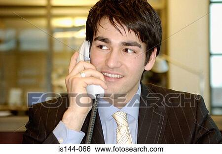Stock Photograph - Businessman using telephone. Fotosearch