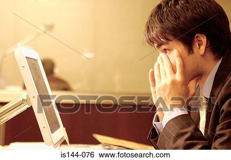 Businessman wiping eyes View Large Photo Image Stock Photograph - Businessman wiping eyes. Fotosearch