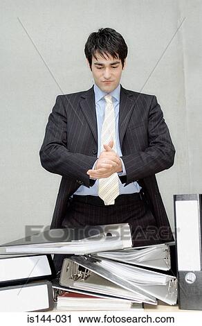 Businessman with hands clasped View Large Photo Image Stock Image - Businessman with hands clasped. Fotosearch