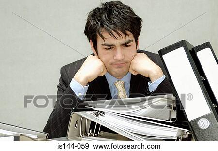 Businessman with messy desk View Large Photo Image Stock Photo - Businessman with messy desk. Fotosearch
