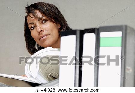Stock Photo - Businesswoman reading document. Fotosearch