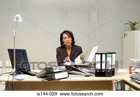 Businesswoman reading document View Large Photo Image Stock Photo - Businesswoman reading document. Fotosearch