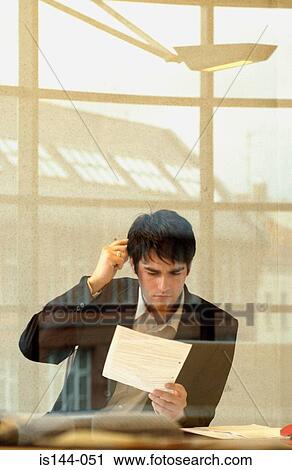 Stock Image - Confused looking businessman. Fotosearch