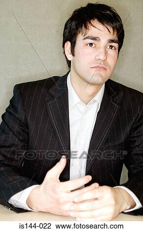 Stock Image - Pensive looking businessman. Fotosearch