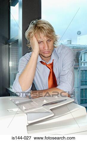 Stock Photo - Portrait of bored office worker. Fotosearch