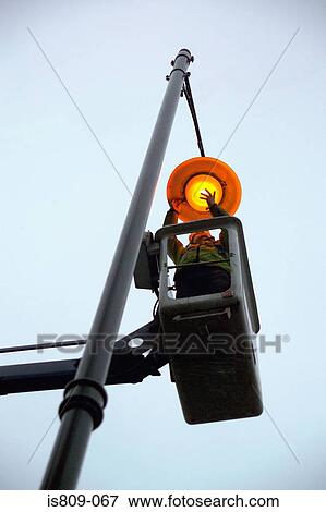 Street light maintenance View Large Photo Image Stock Photo - Street light maintenance. Fotosearch